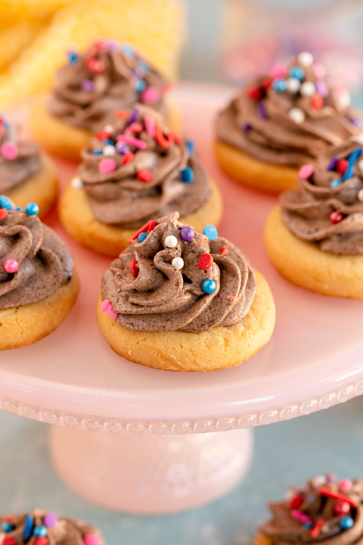 grey stuff on a sugar cookie on a cookie plate