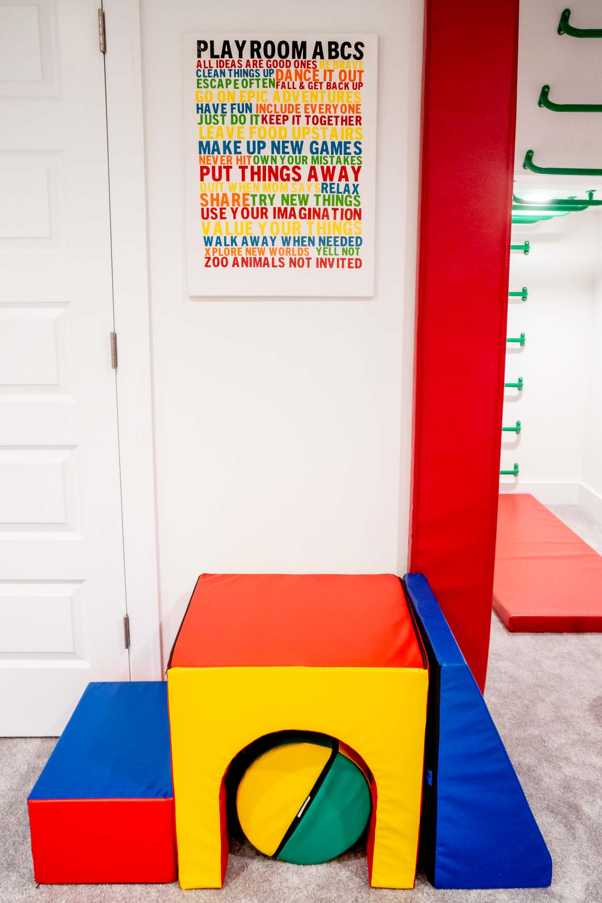 playroom rules sign above foam blocks