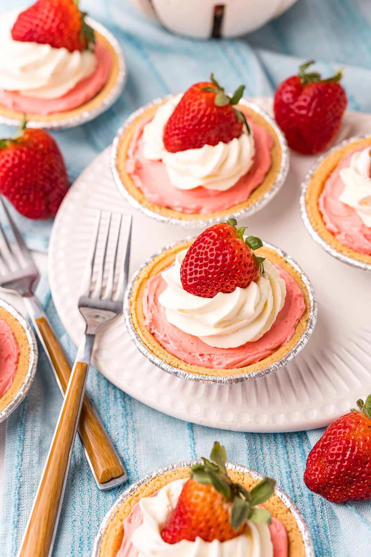 mini kool-aid pies with strawberries on top