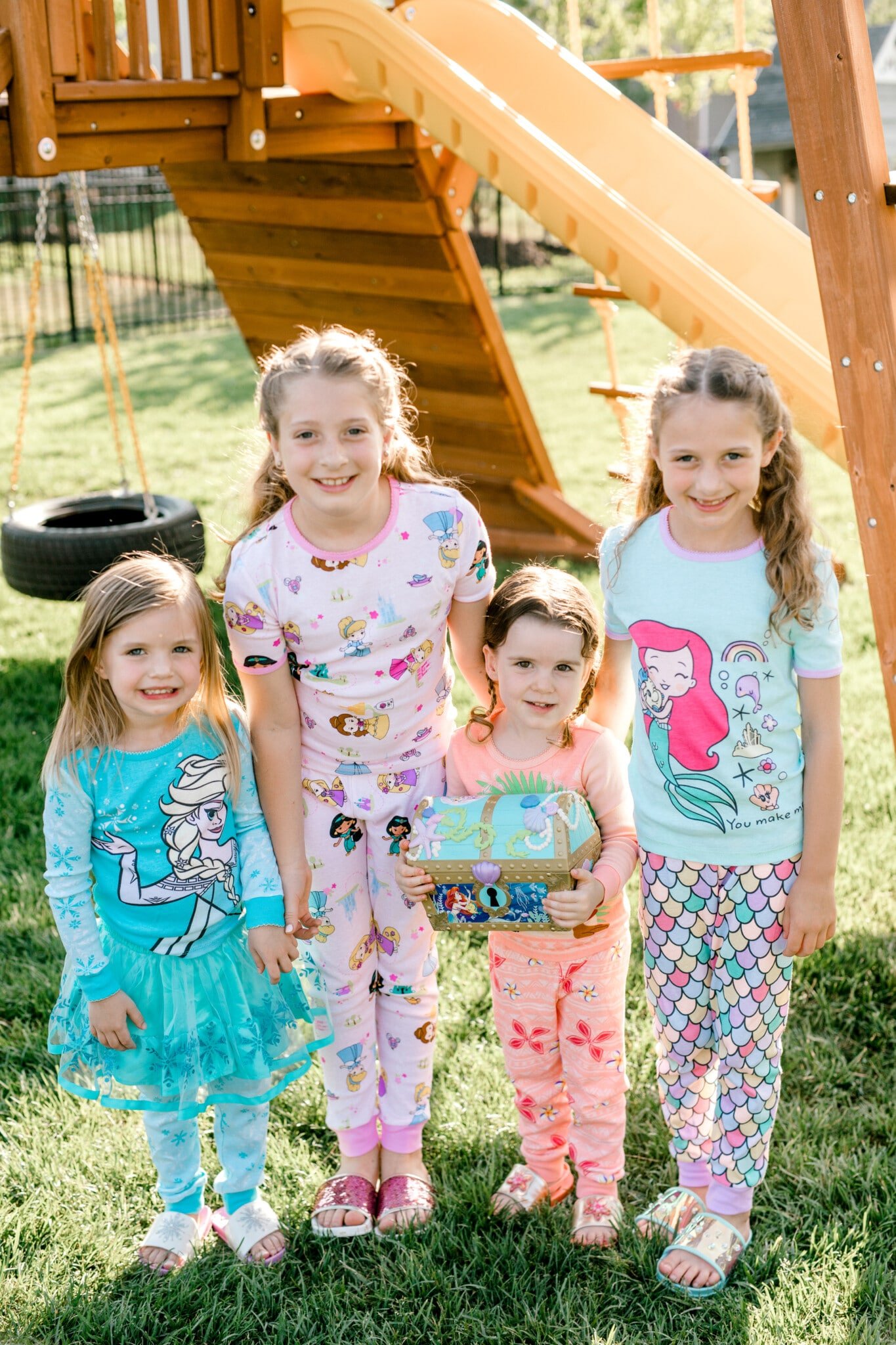 girls standing together in princess pajamas