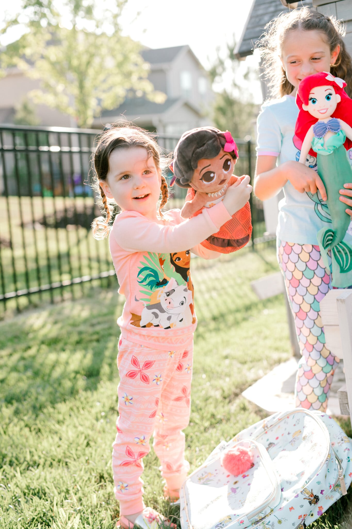 girl holding a moana doll