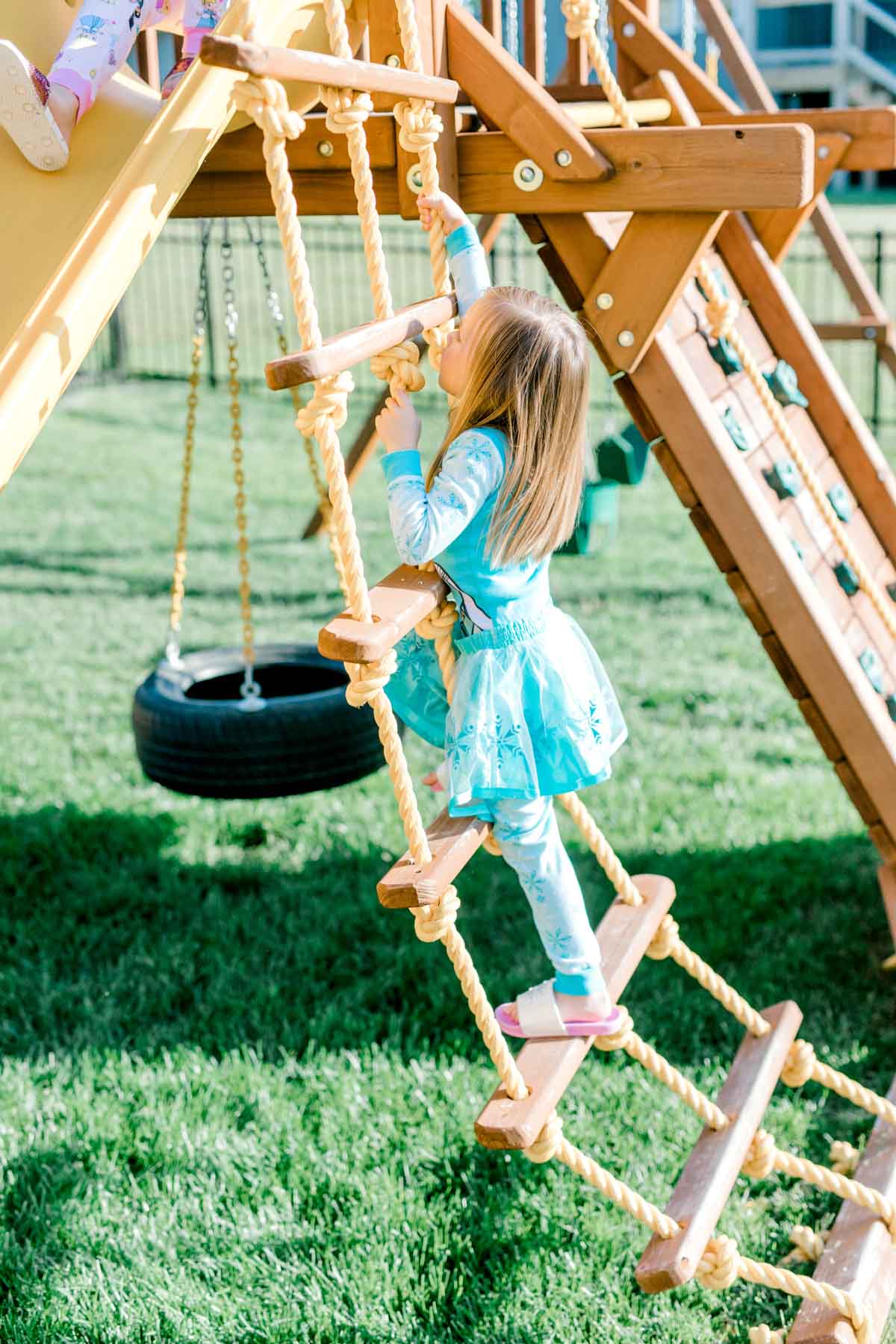 girl climbing a rope ladder