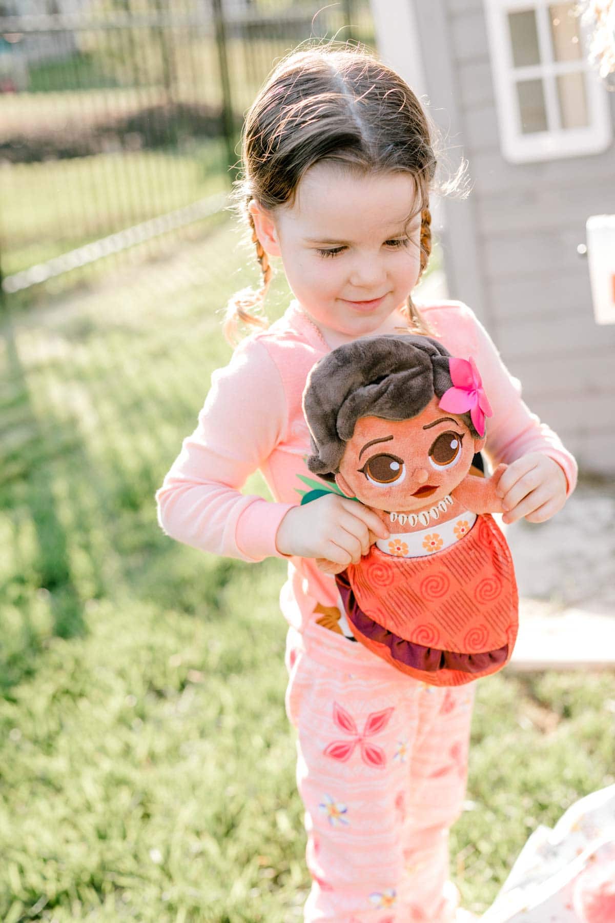 girl holding a MOana baby