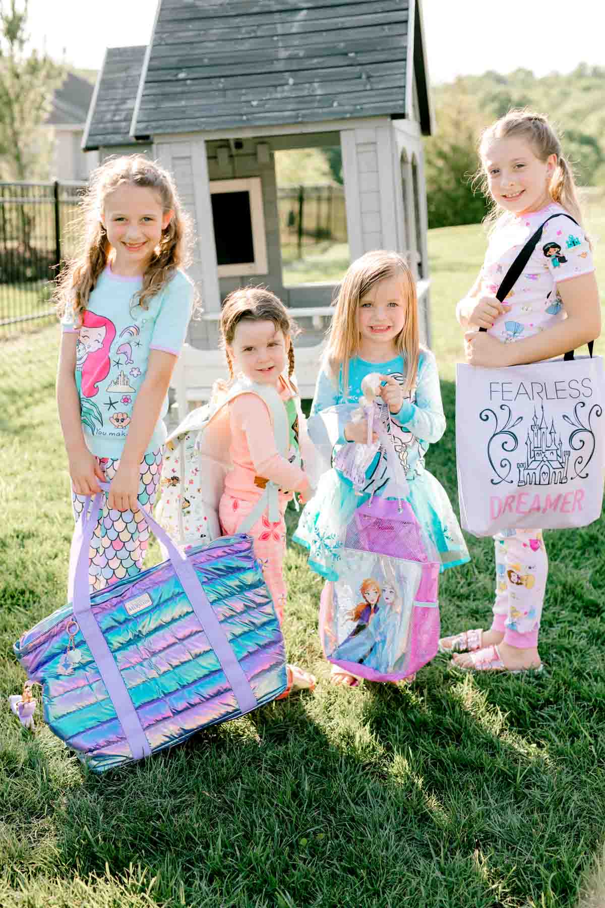 girls holding princess bags