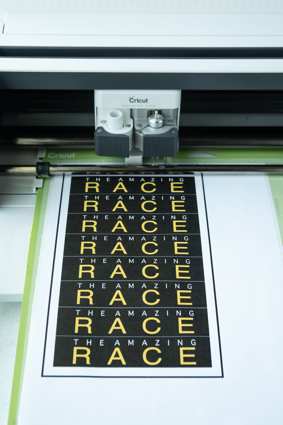 Amazing Race envelope stickers loaded onto a Cricut Maker