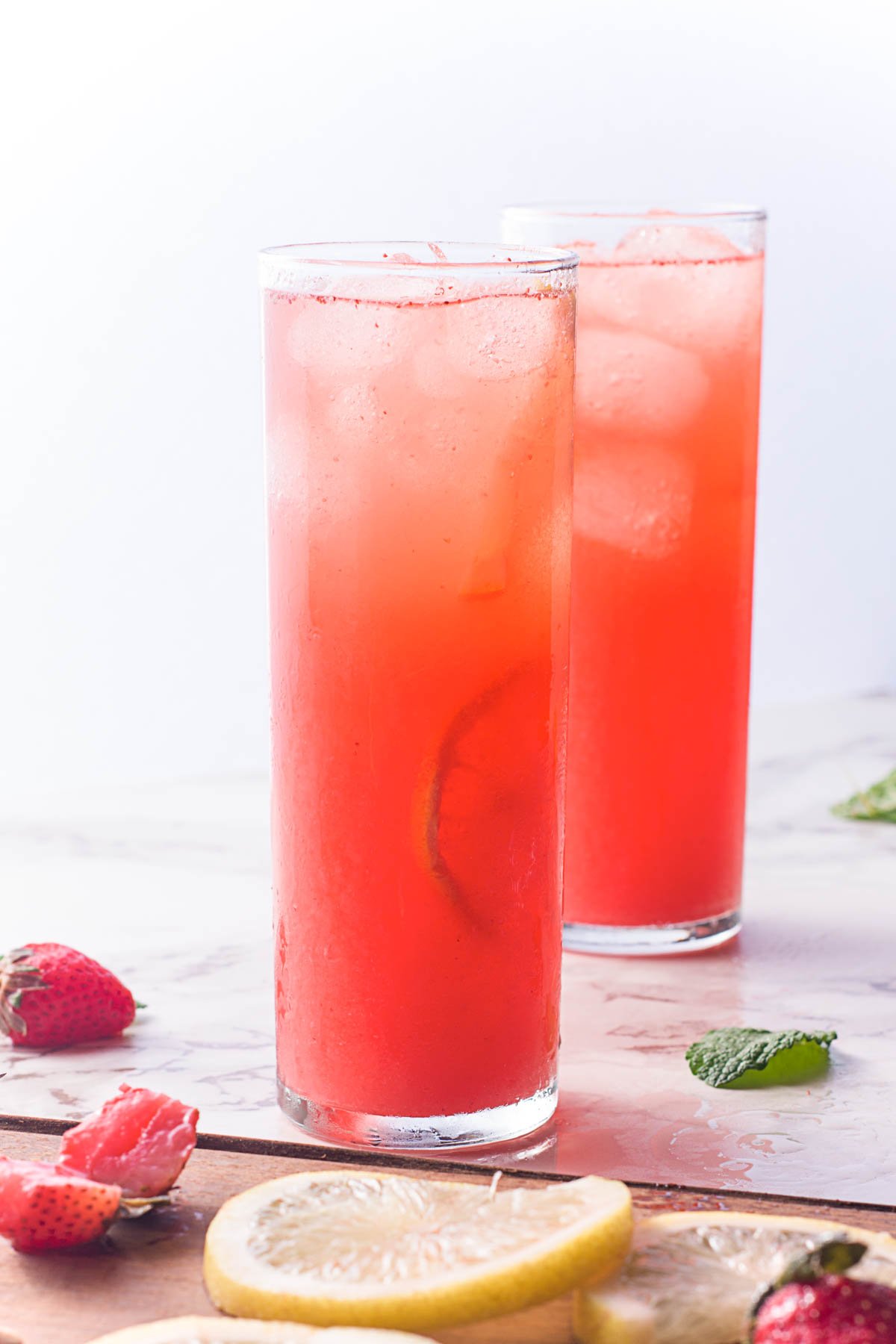 two glasses of homemade strawberry lemonade