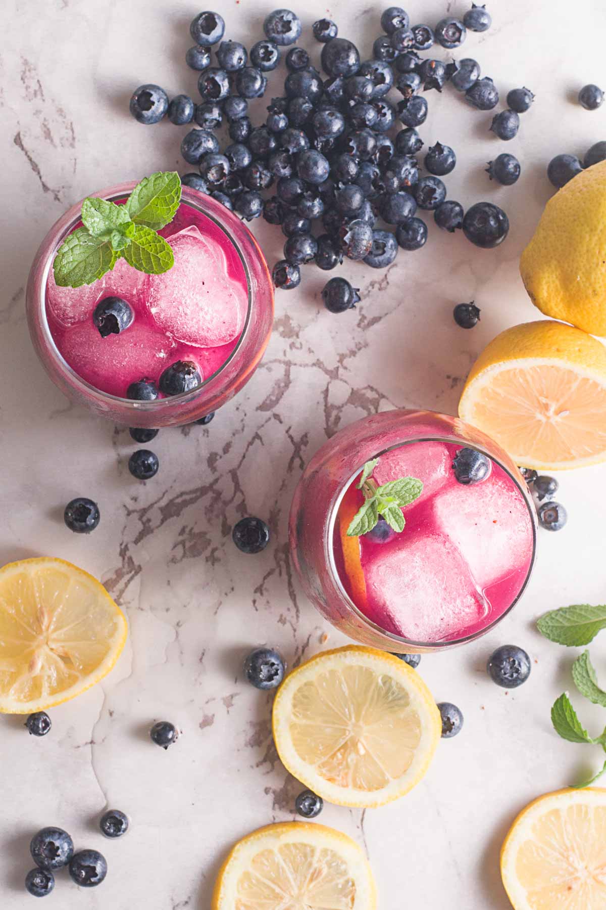 two glasses of blueberry lemonade from the top view