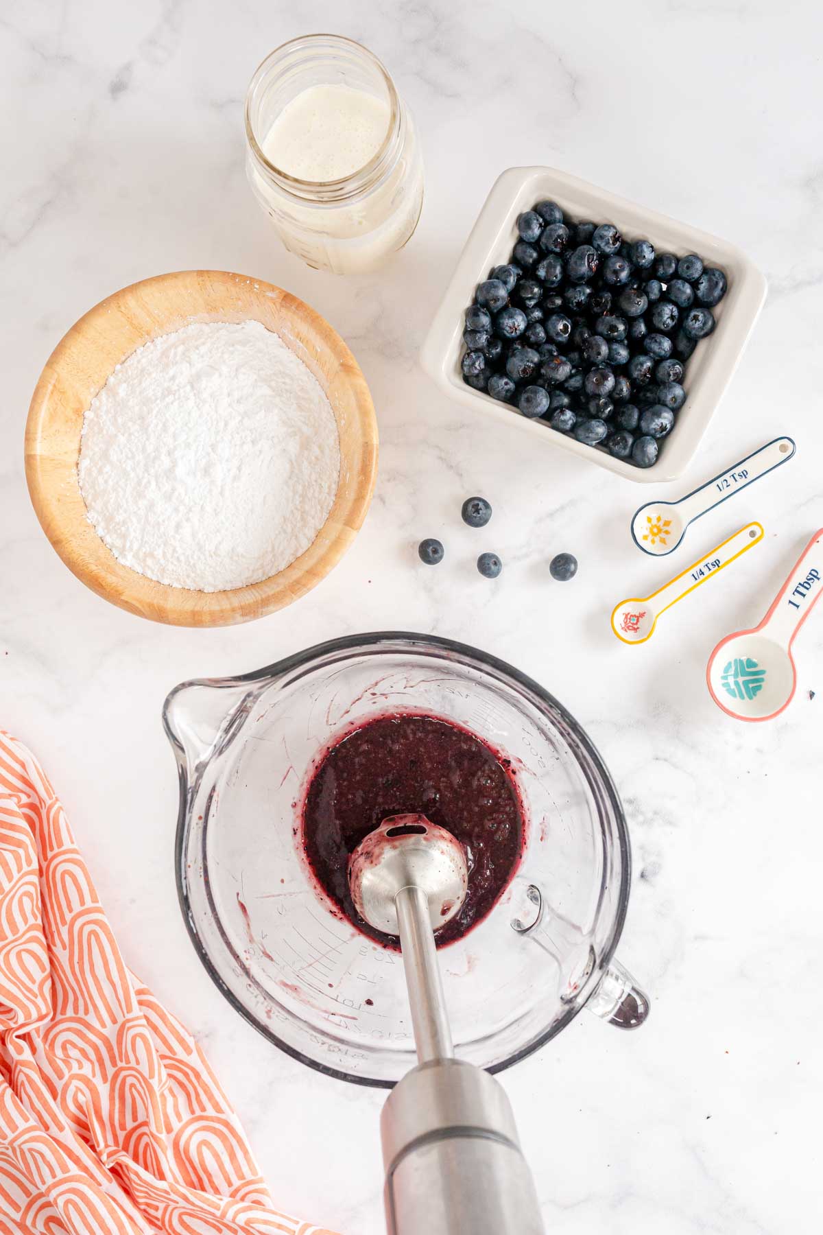 mashed blueberries in a glass bowl