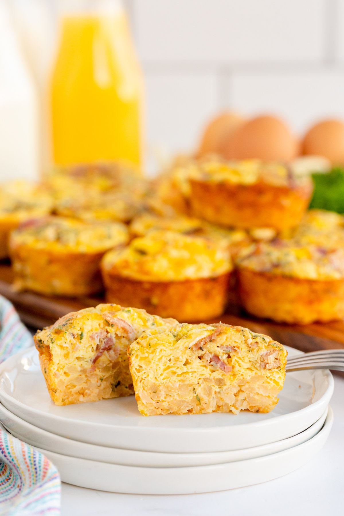 breakfast muffins on a white plate cut in half