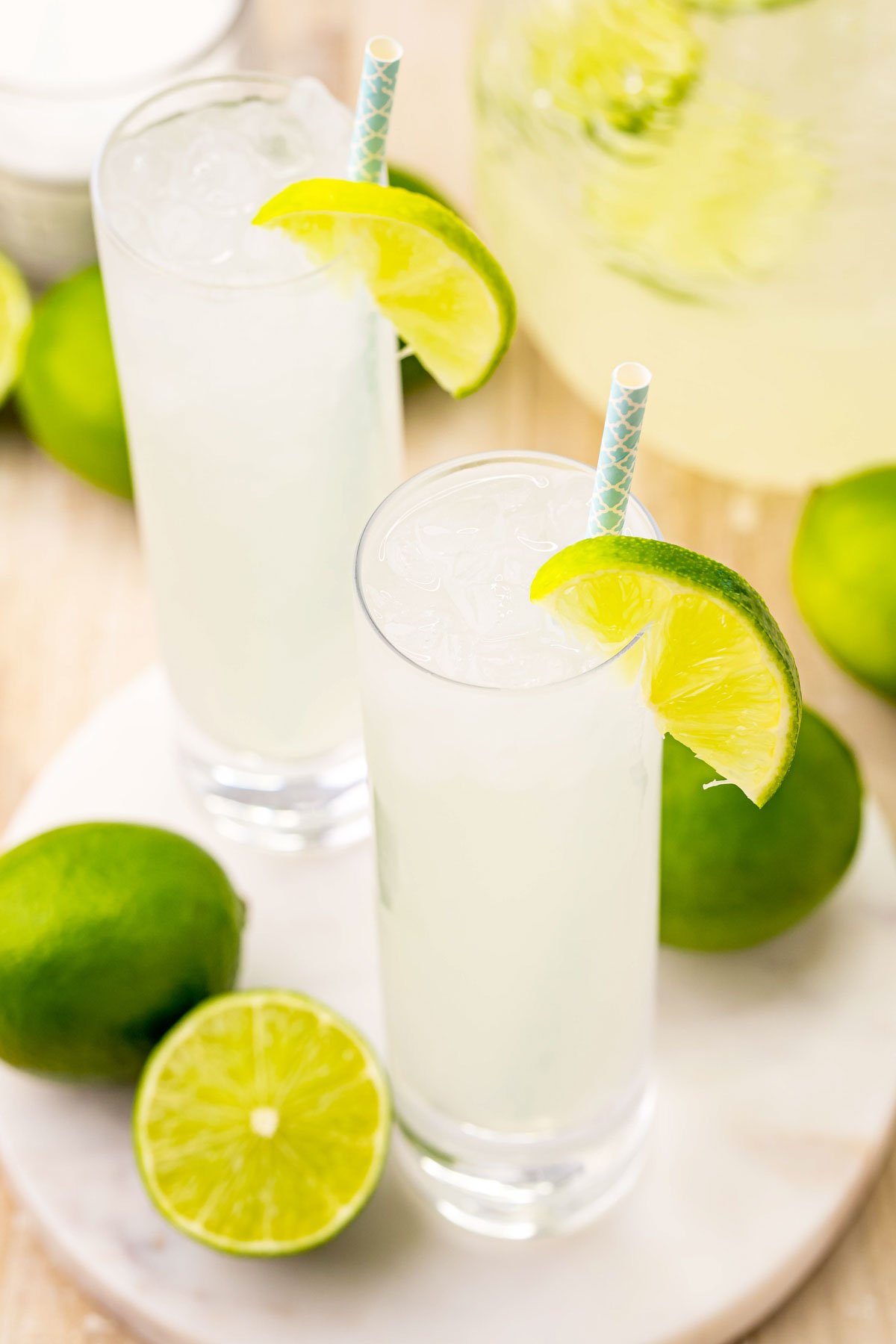 two glasses of homemade limeade with straws