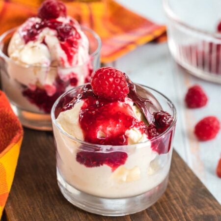 glass of ice cream with homemade raspberry sauce