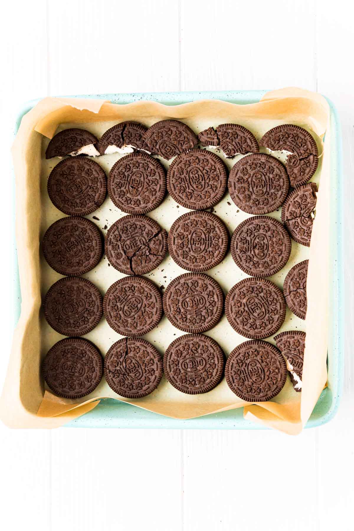 line of Oreos on the bottom of a square pan