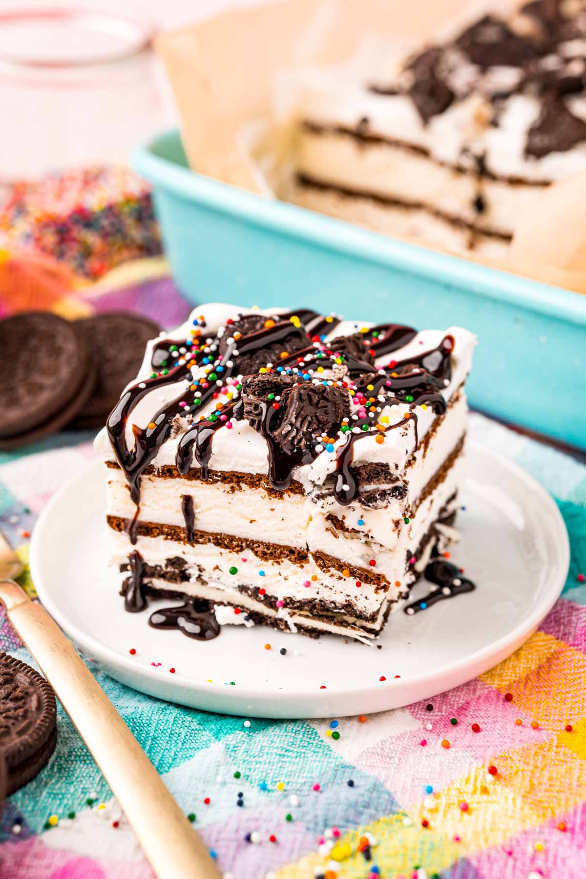 slice of Oreo ice cream cake on a white plate