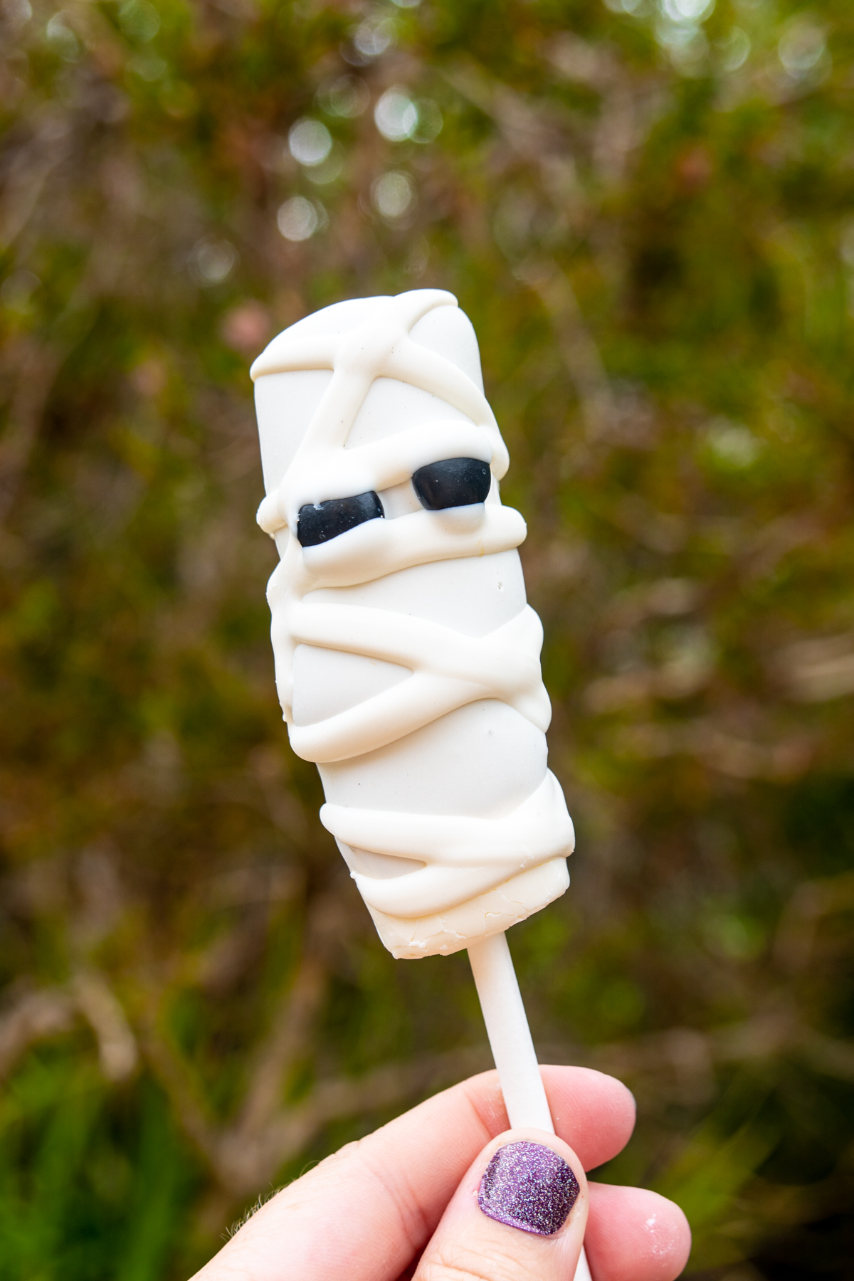 mummy marshmallow wand in someone's hand