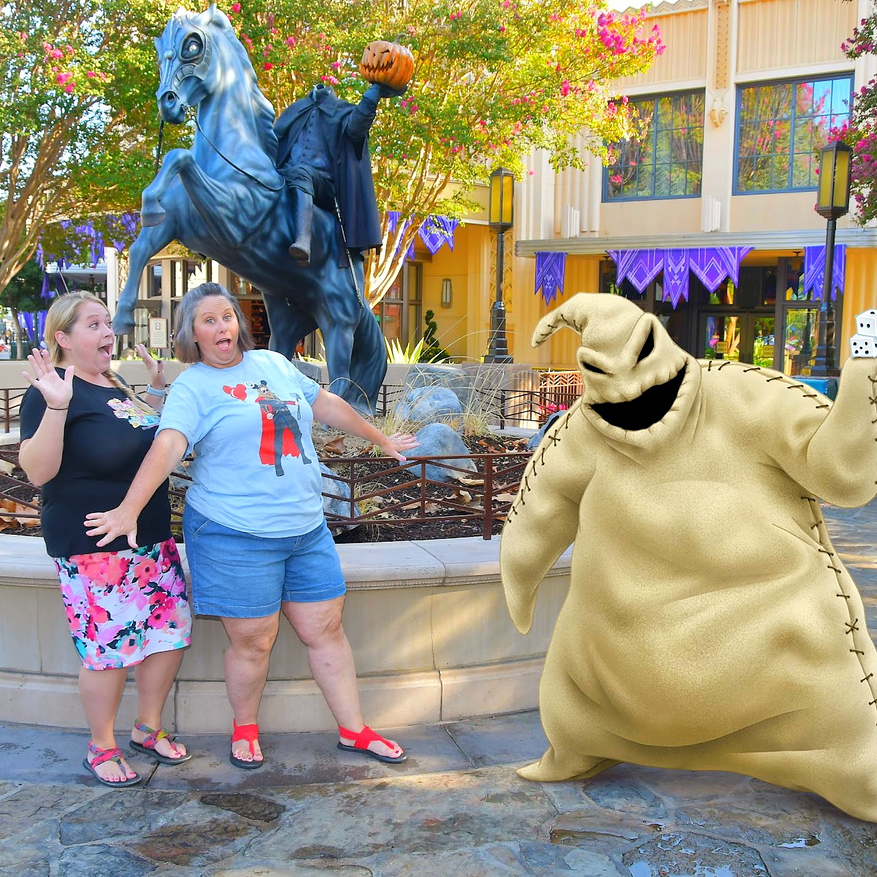 two girls taking a picture with Oogie Boogie