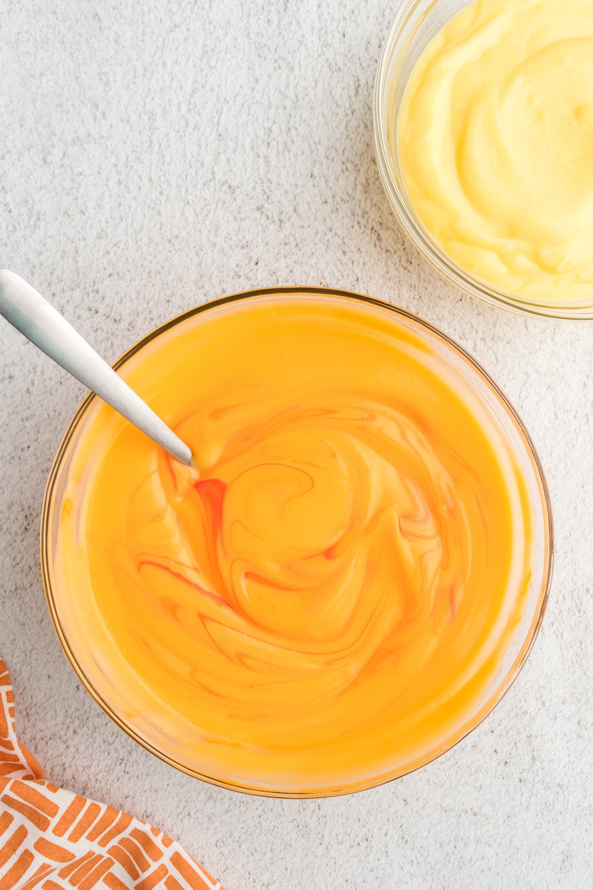 orange vanilla pudding in a glass bowl