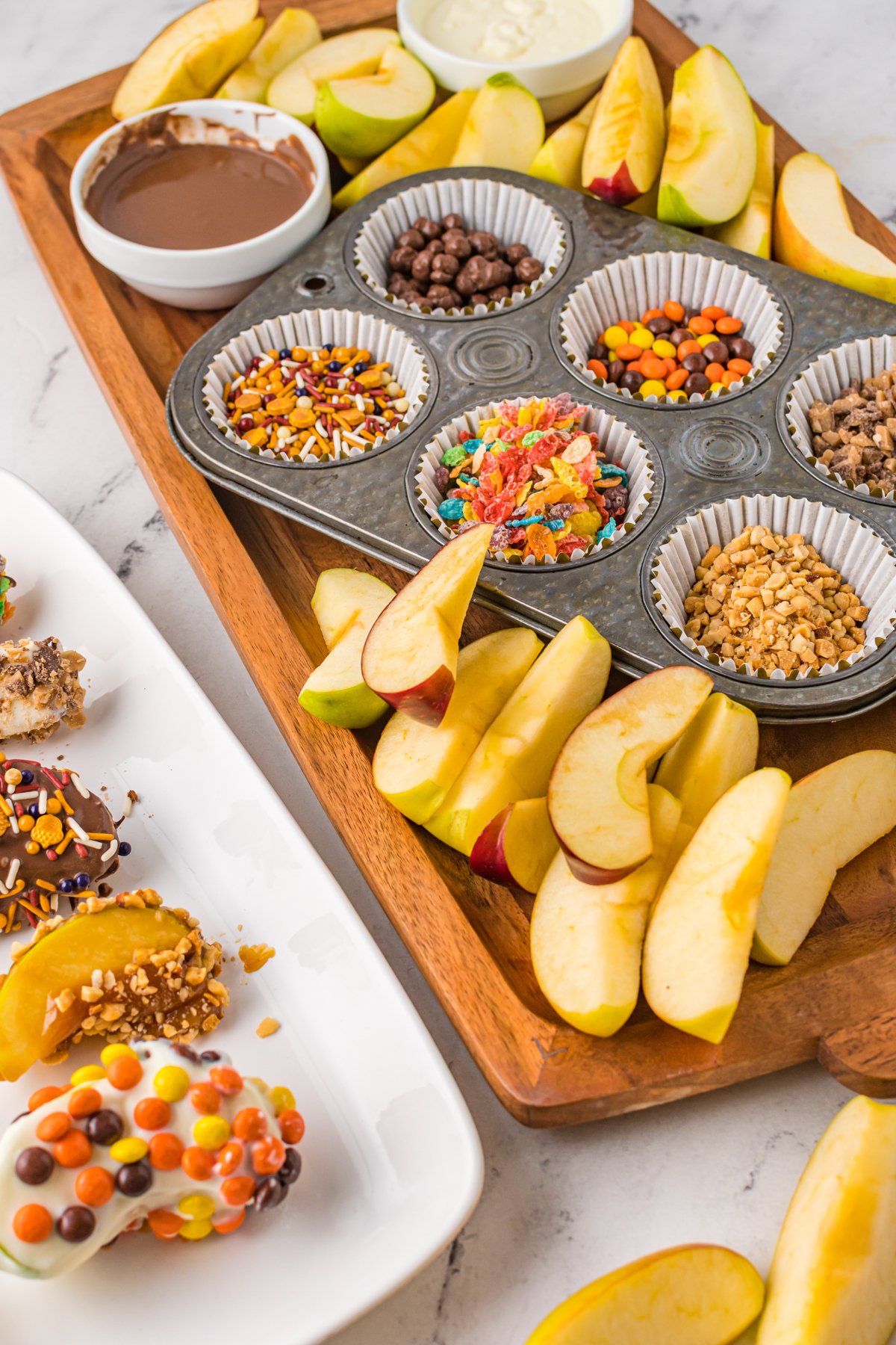 apple slices on a caramel apple board