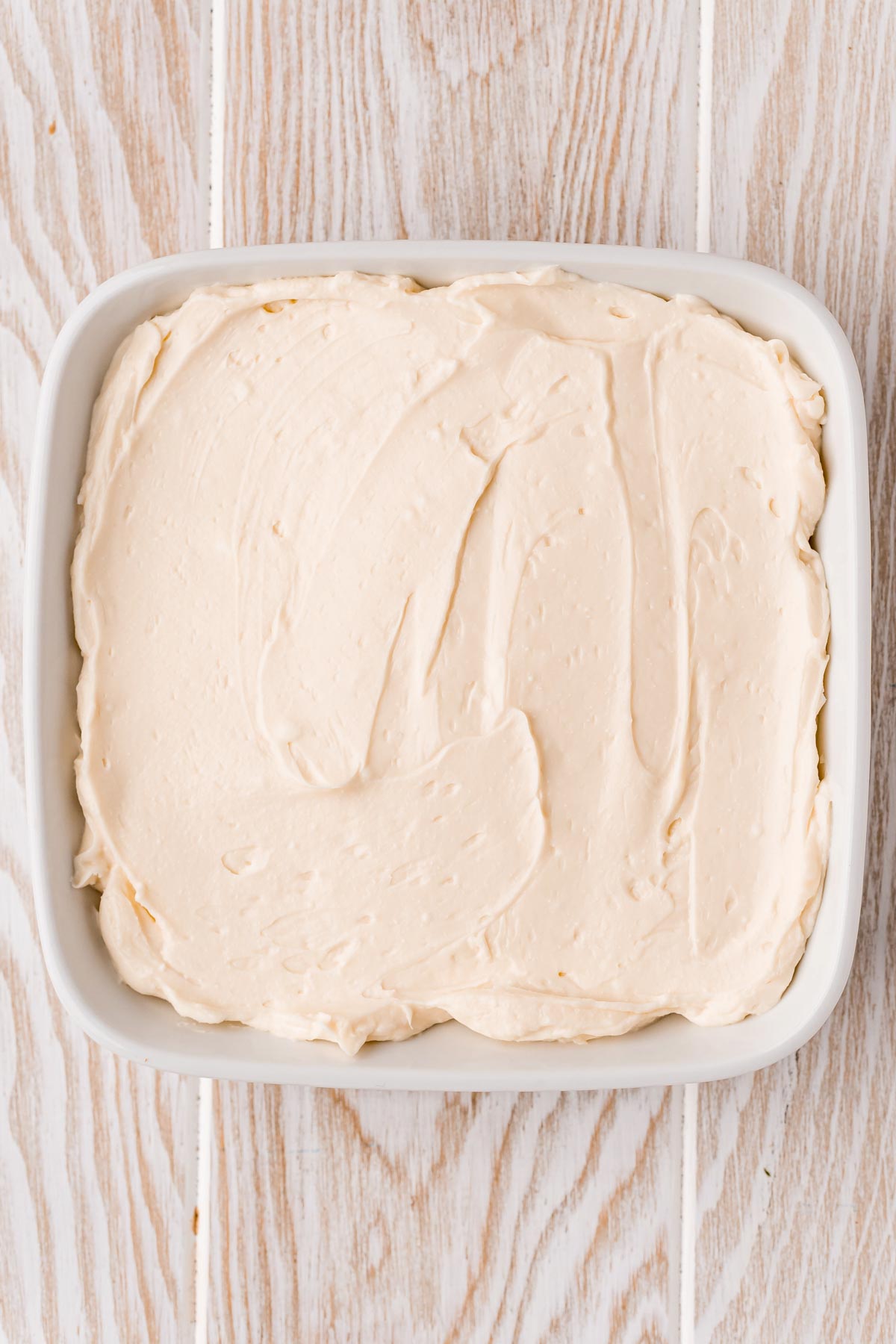cream cheese dip in a white square dish