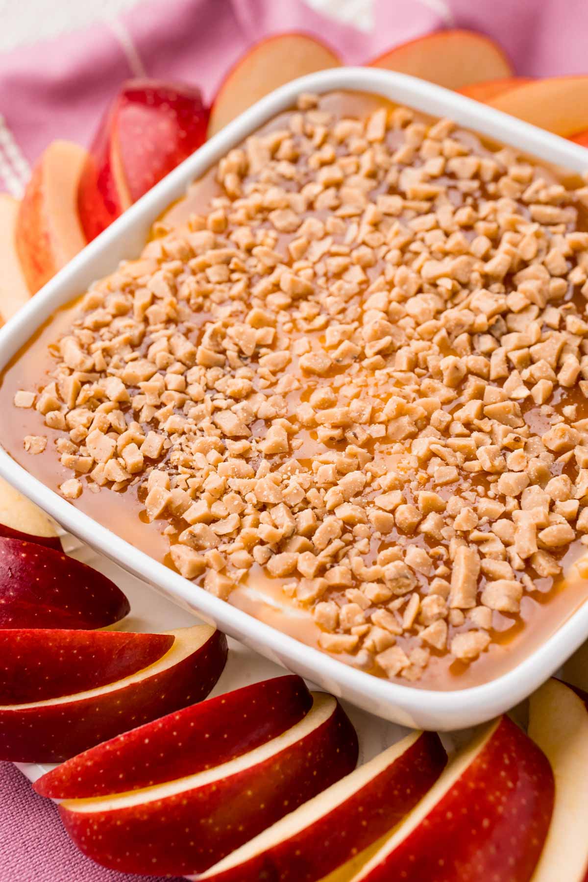 Cream cheese caramel apple dip with apple slices around