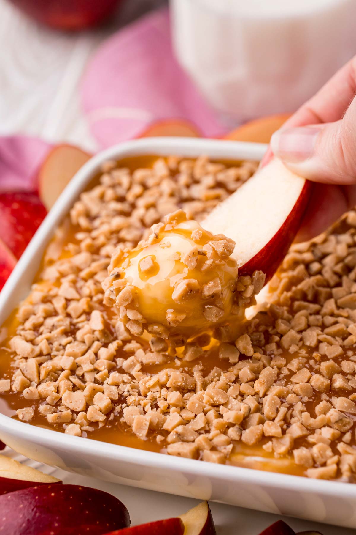 apple dipped into a cream cheese caramel apple dip