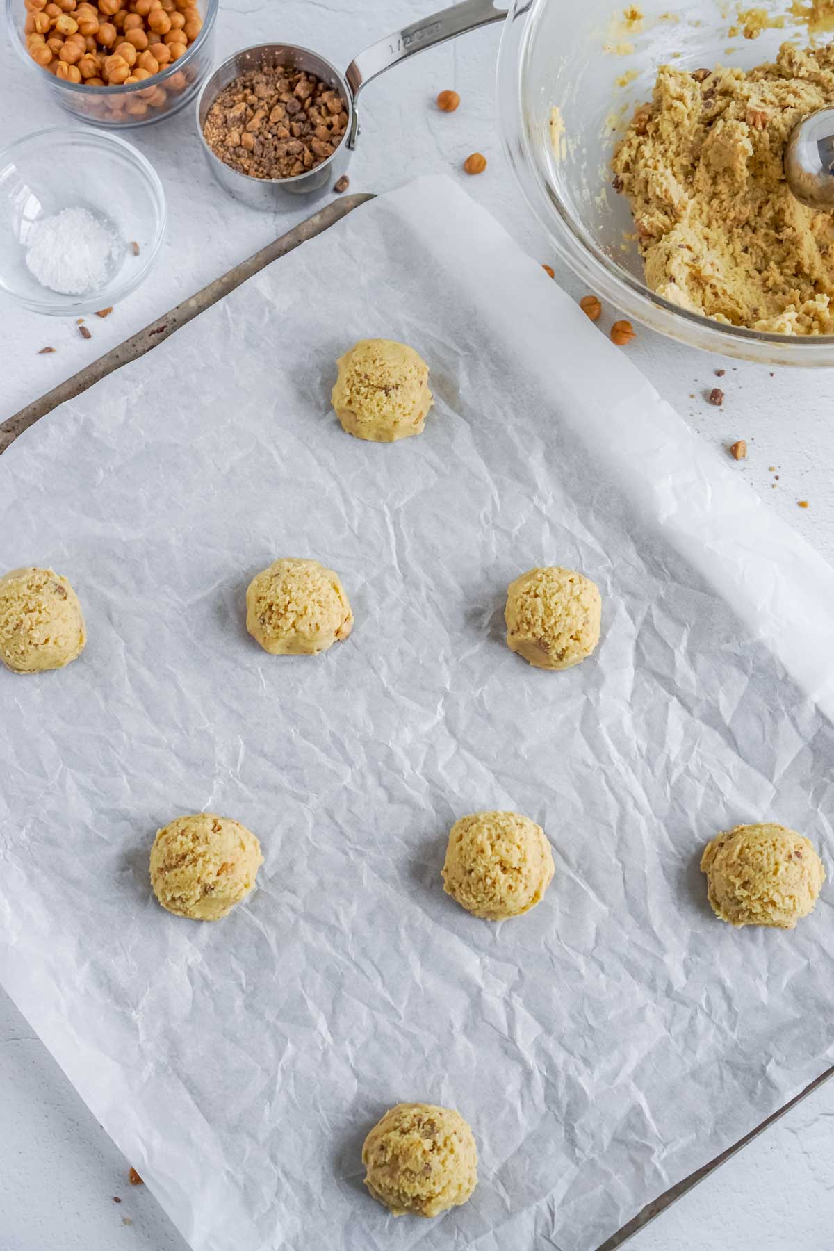 unbaked caramel toffee cookies on a baking sheet