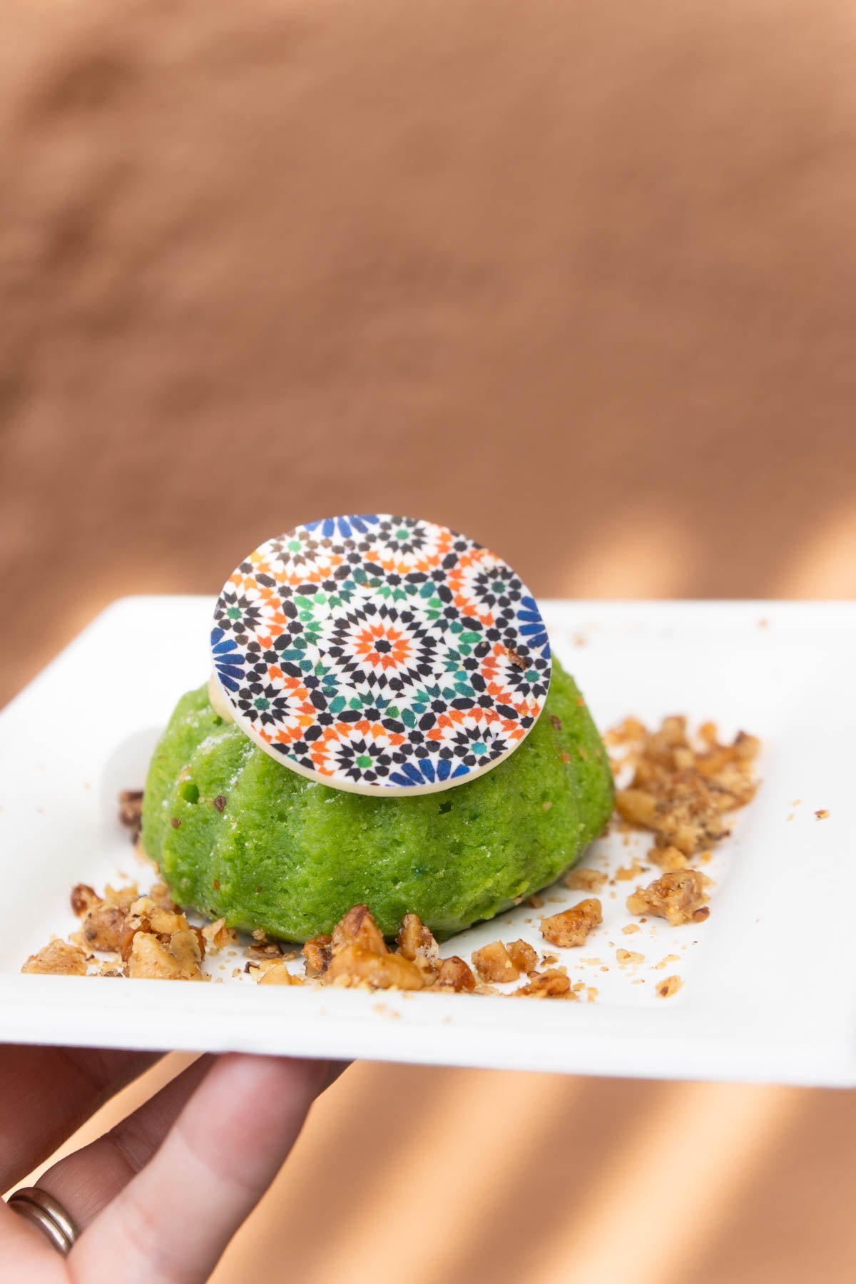 pistachio cake on a white plate