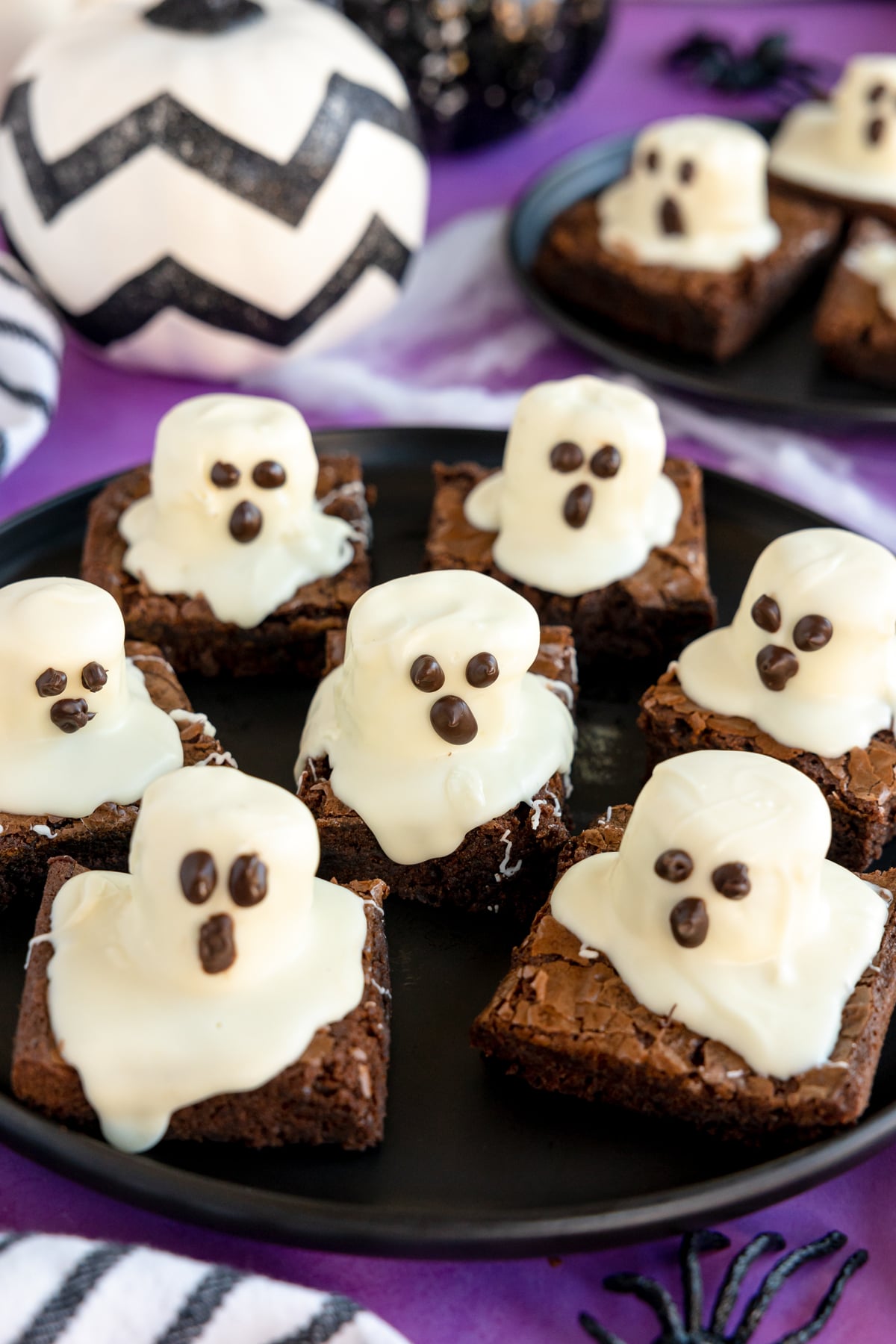 black plate with ghost brownies on it