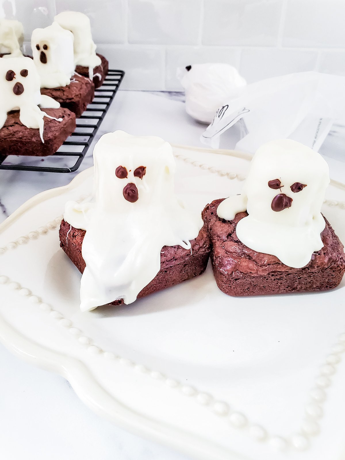 ghost brownies on a white tablecloth