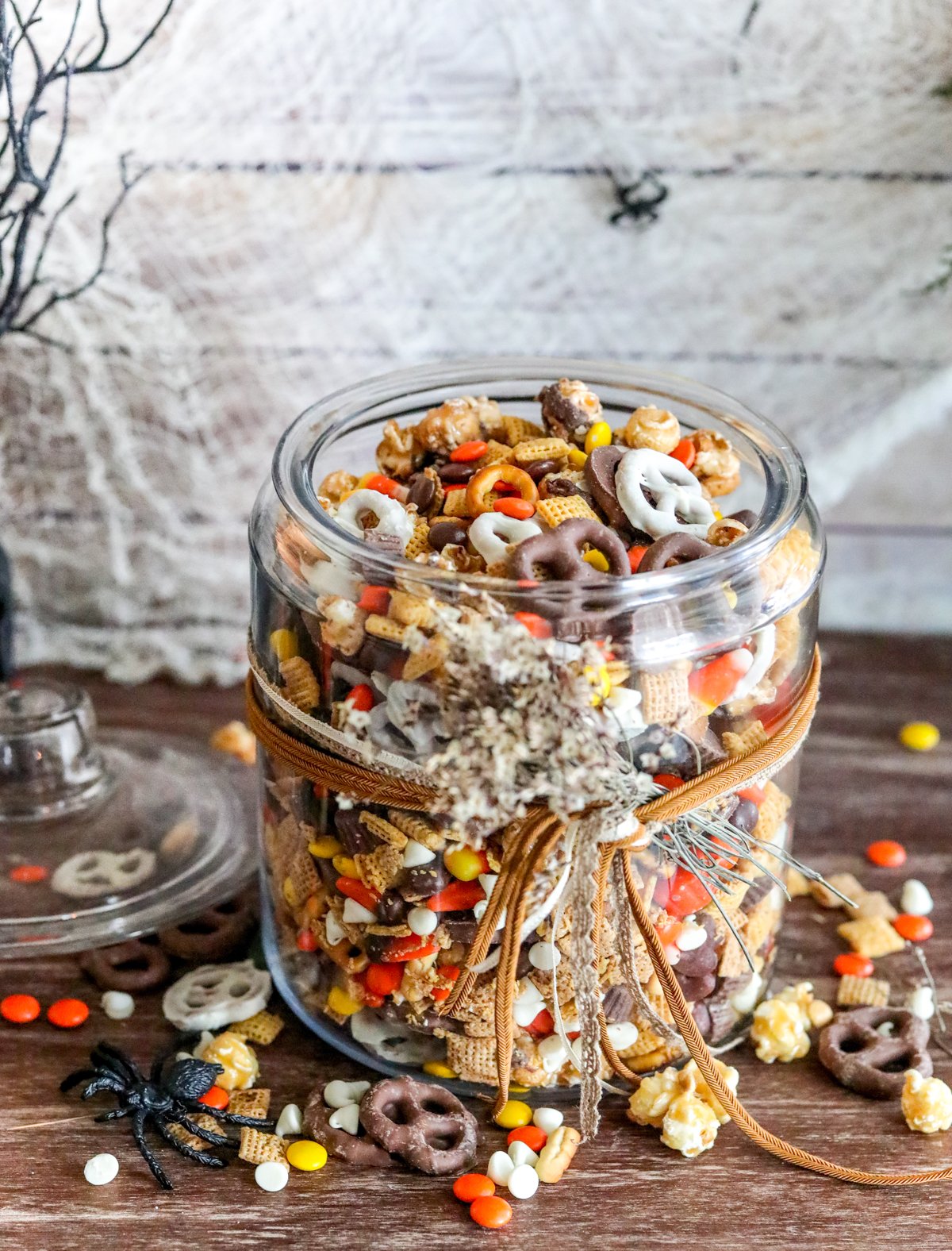 large glass jar of Halloween snack mix
