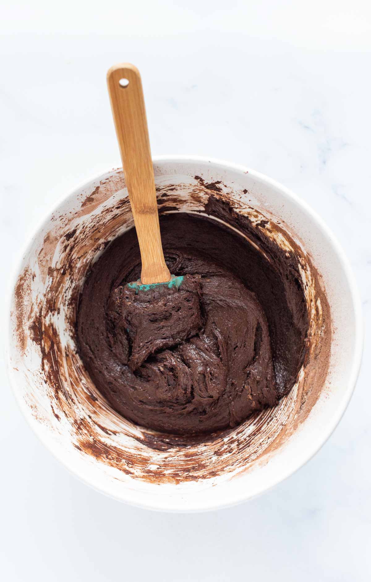batter for homemade brownies in a white bowl