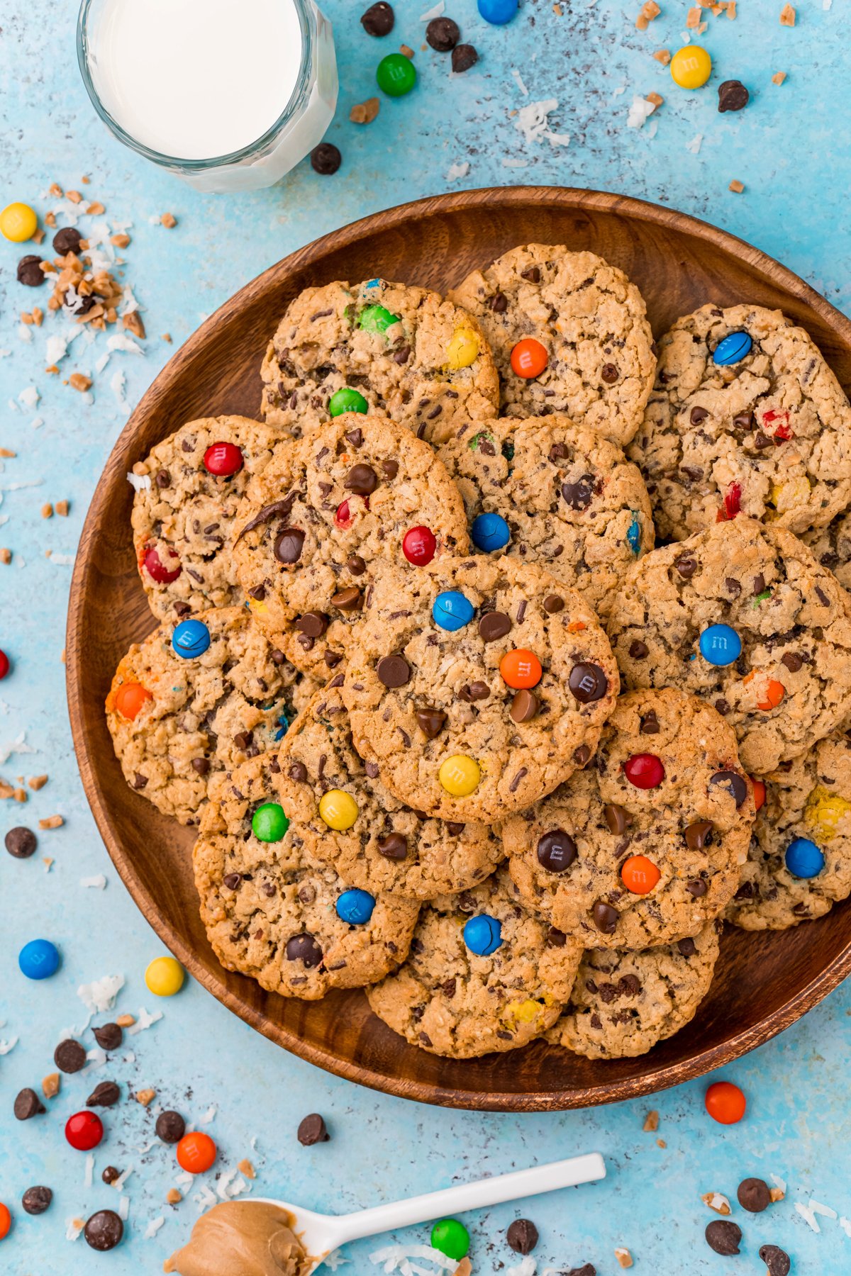 wood plate with a pile of monster cookies