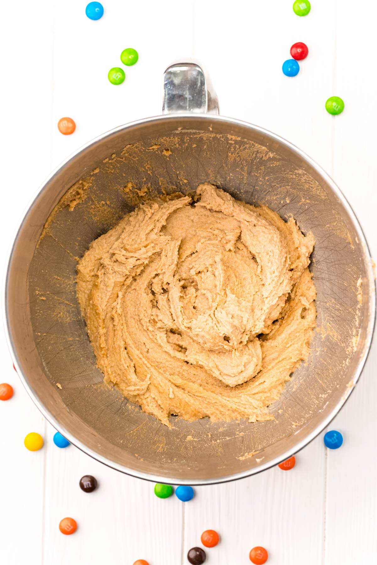 creamed butter and sugars in a metal bowl