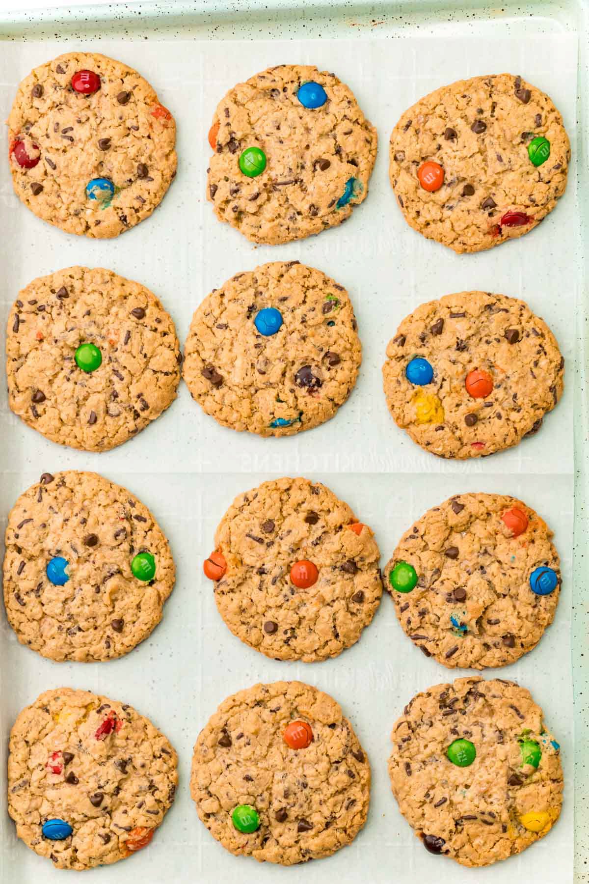 baked monster cookies on a baking sheet