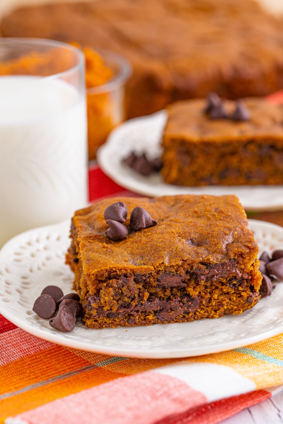 two pumpkin blondies on white plates