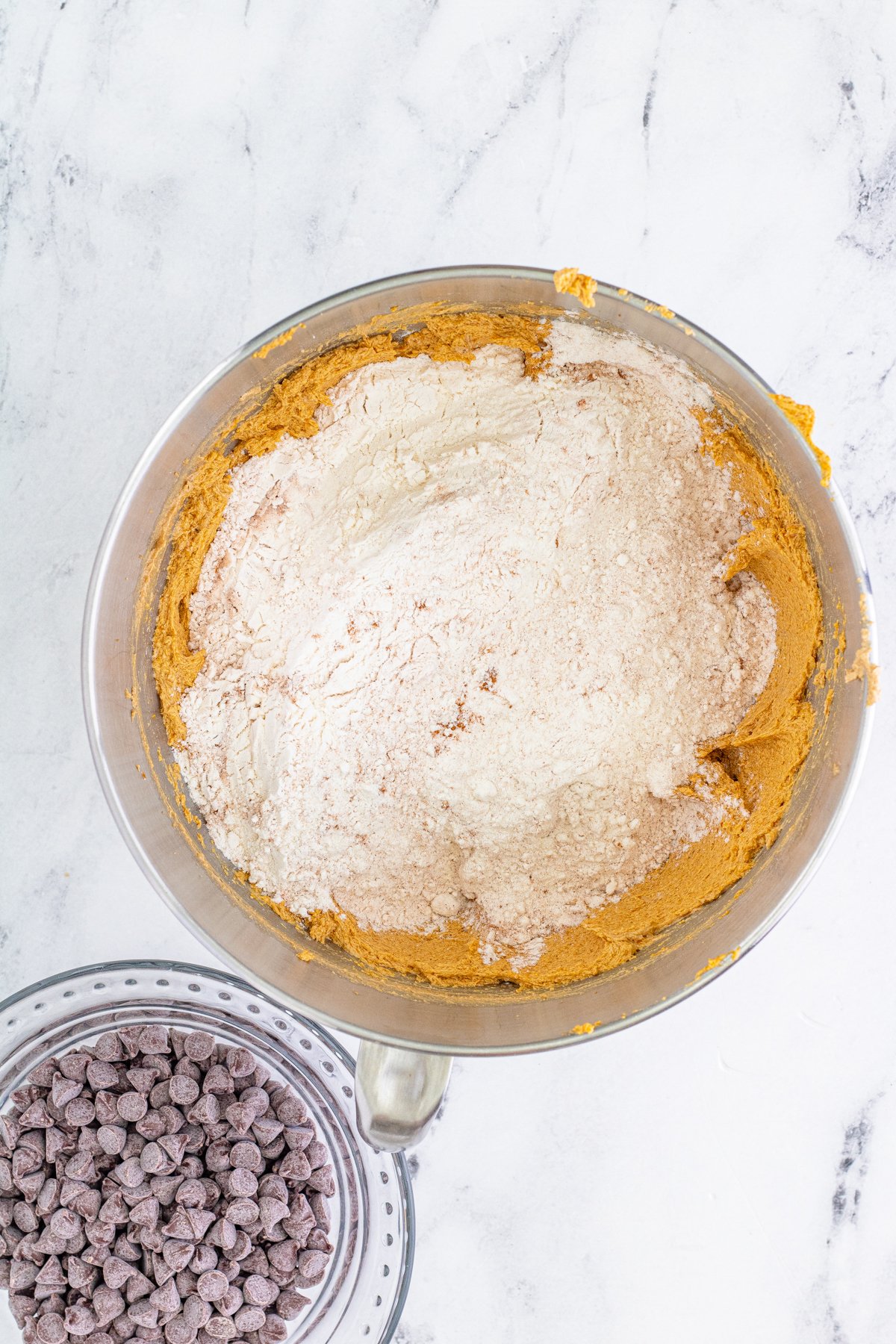 metal bowl with flour and pumpkin blondie mixture