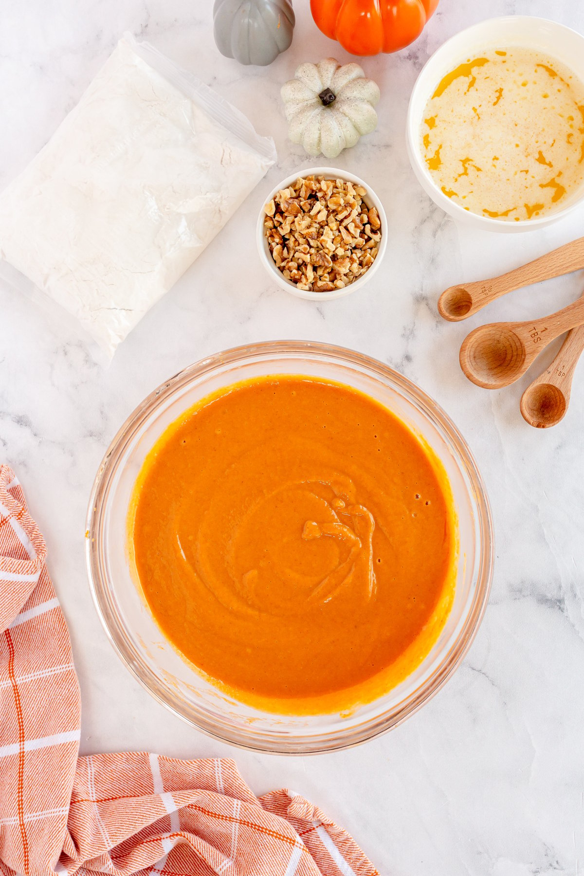 Pumpkin and spices mixed in a mixing bowl