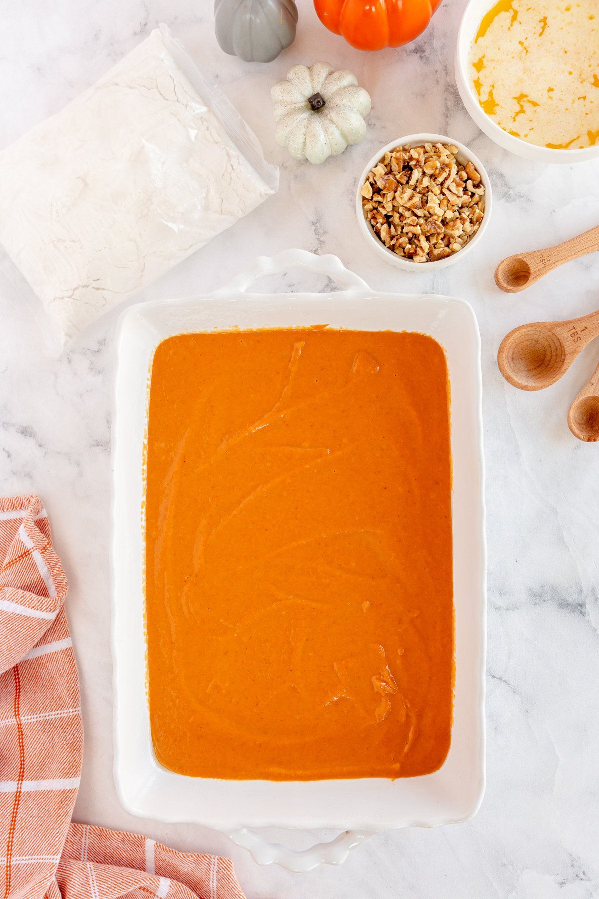 pumpkin puree on the bottom of a baking dish