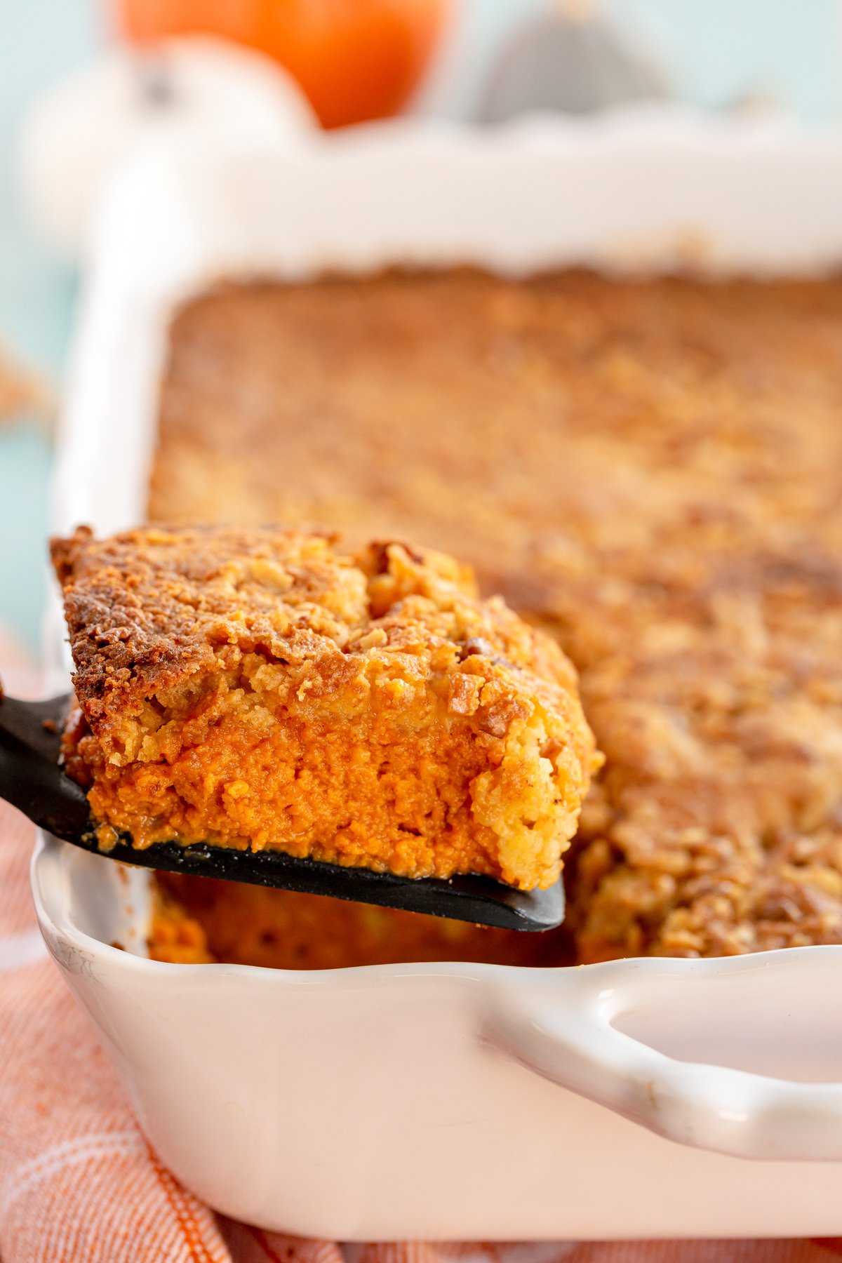 a piece of pumpkin crunch cake on a spatula