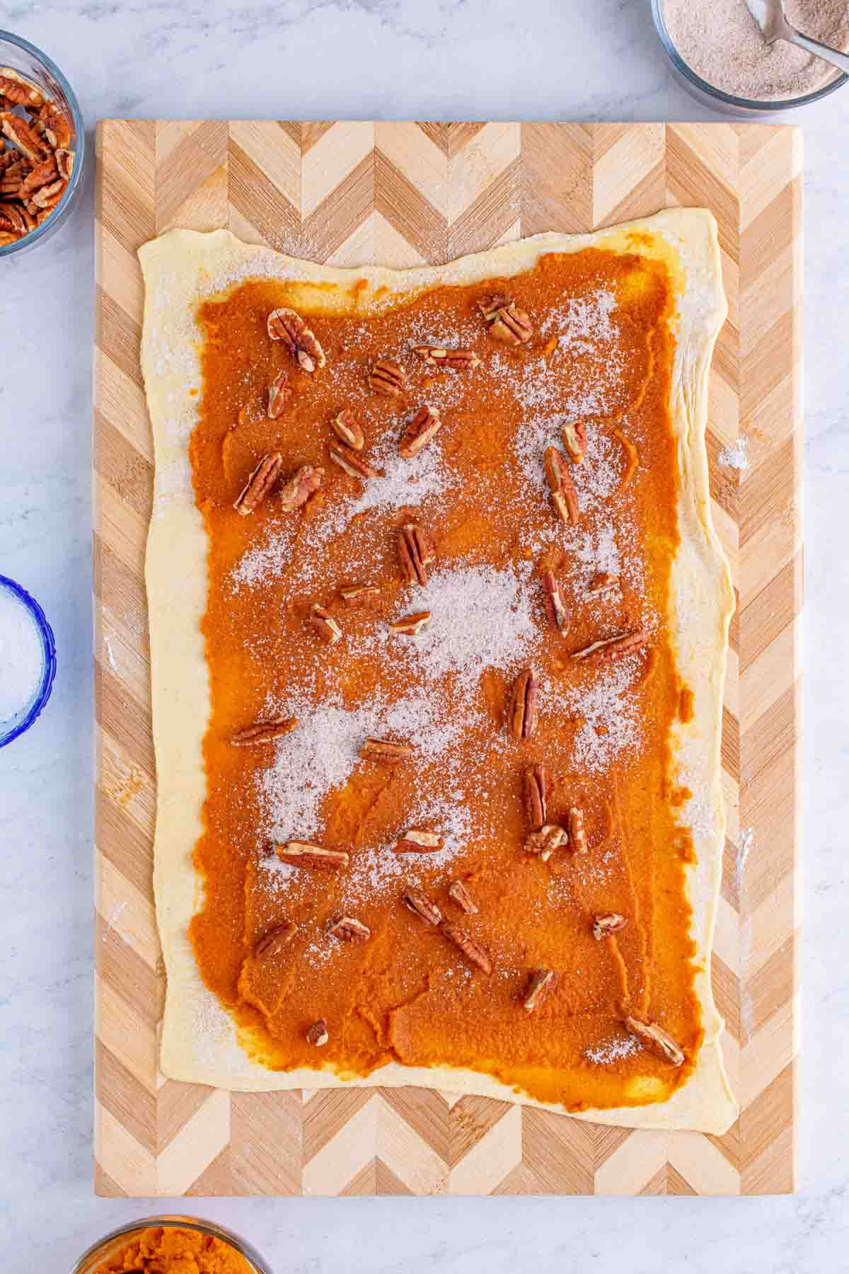 puff pastry topped with pumpkin puree and pecans