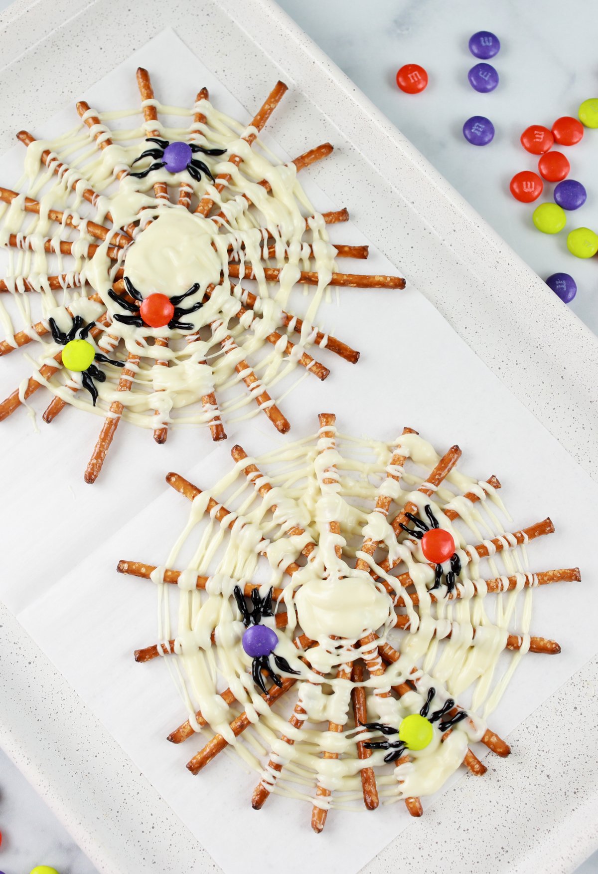 pretzel spider webs on a white plate