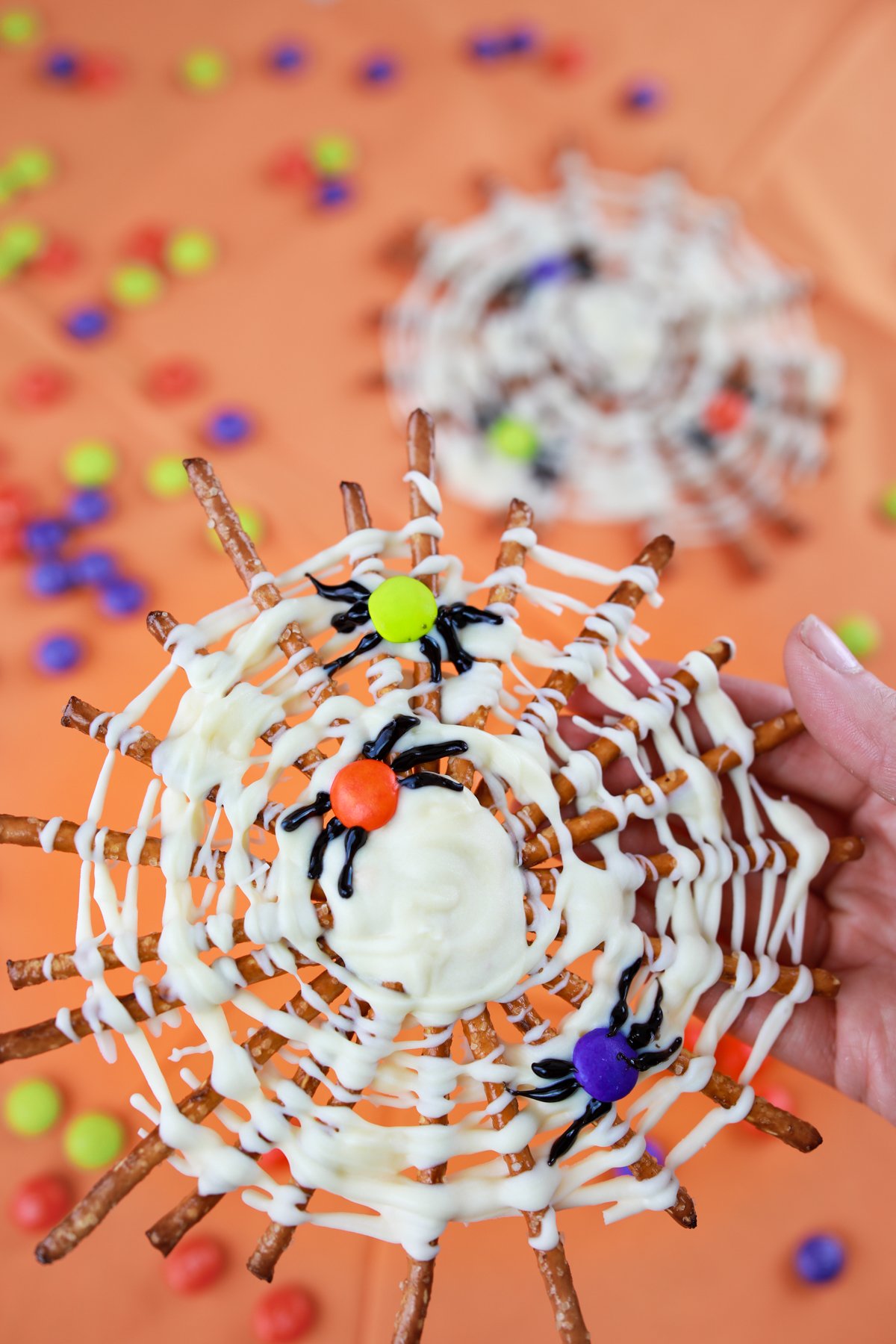 pretzel spider webs on an orange background