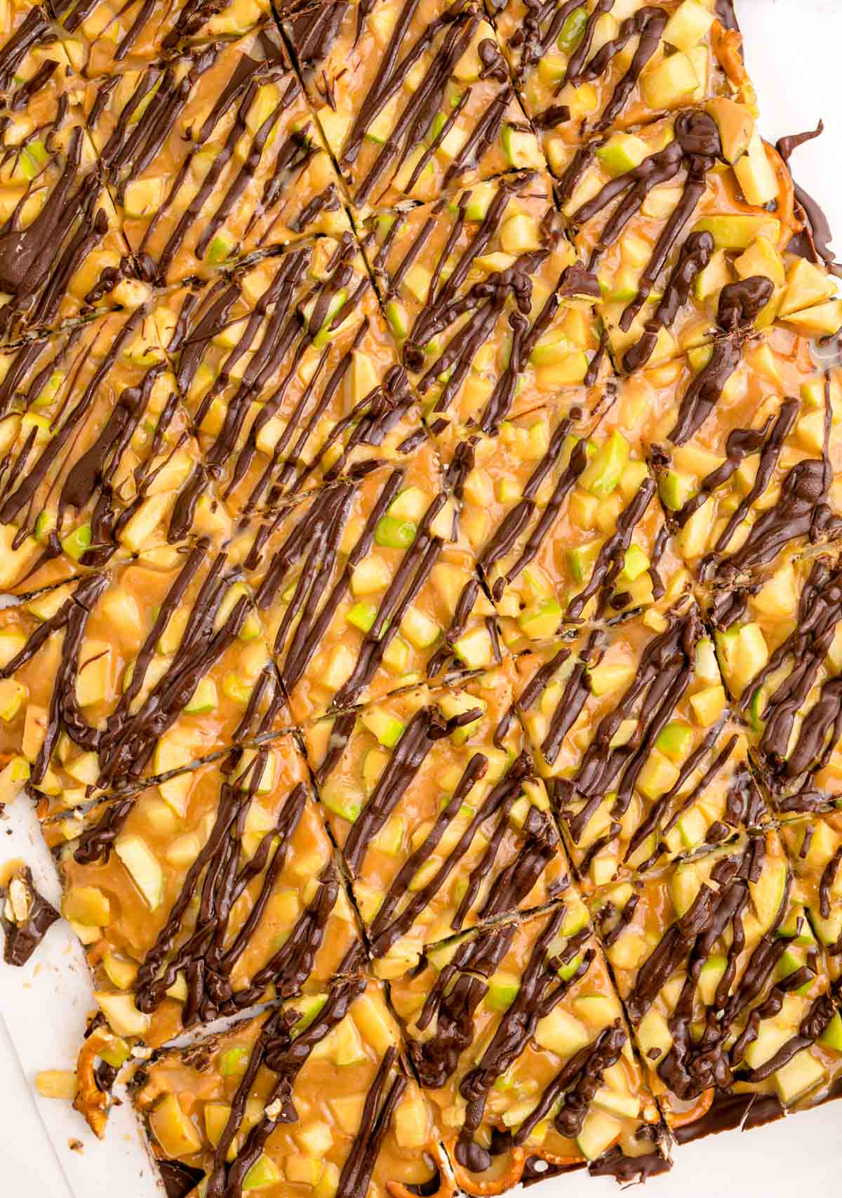 chocolate drizzled on top of caramel apple bark