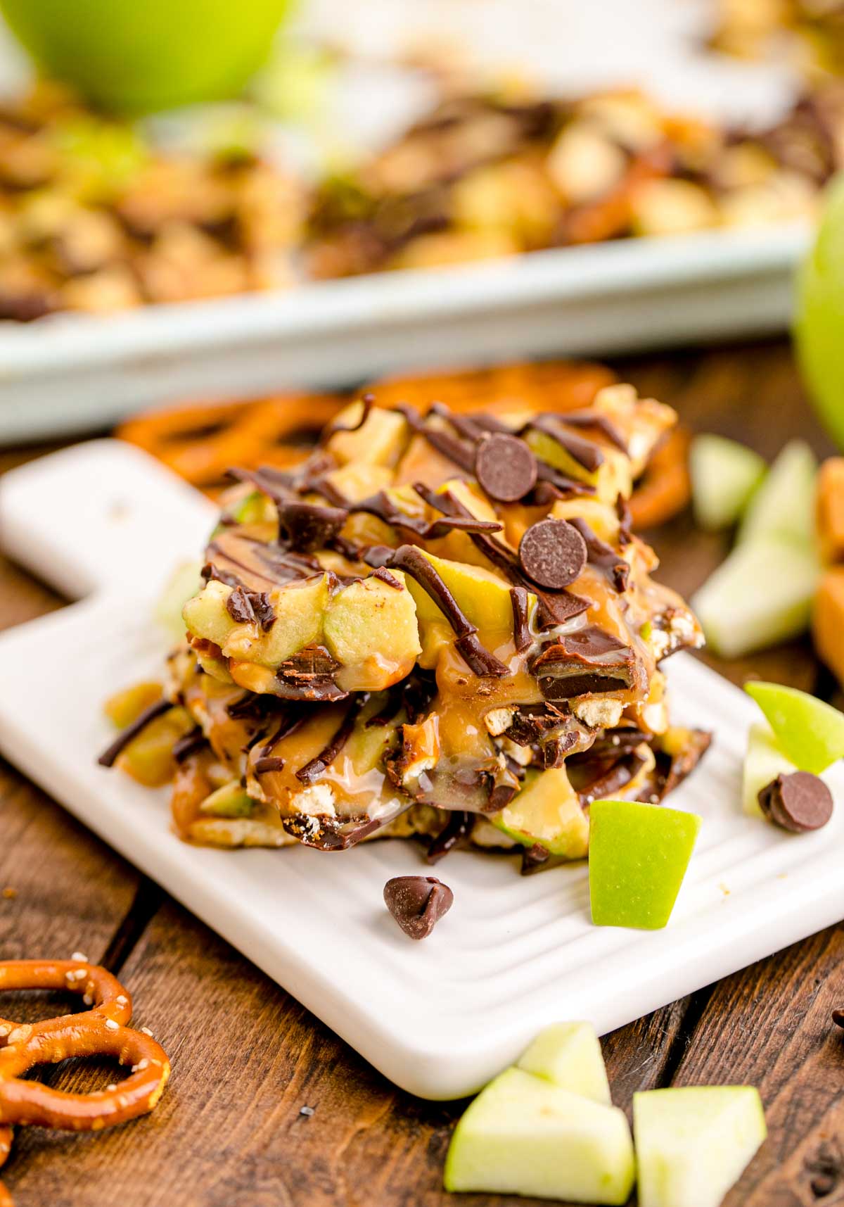stack of pieces of caramel apple bark on a cutting board