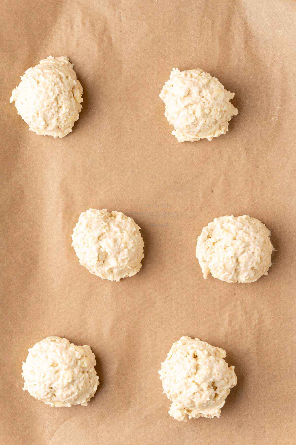 scoops of drop biscuits on a baking sheet
