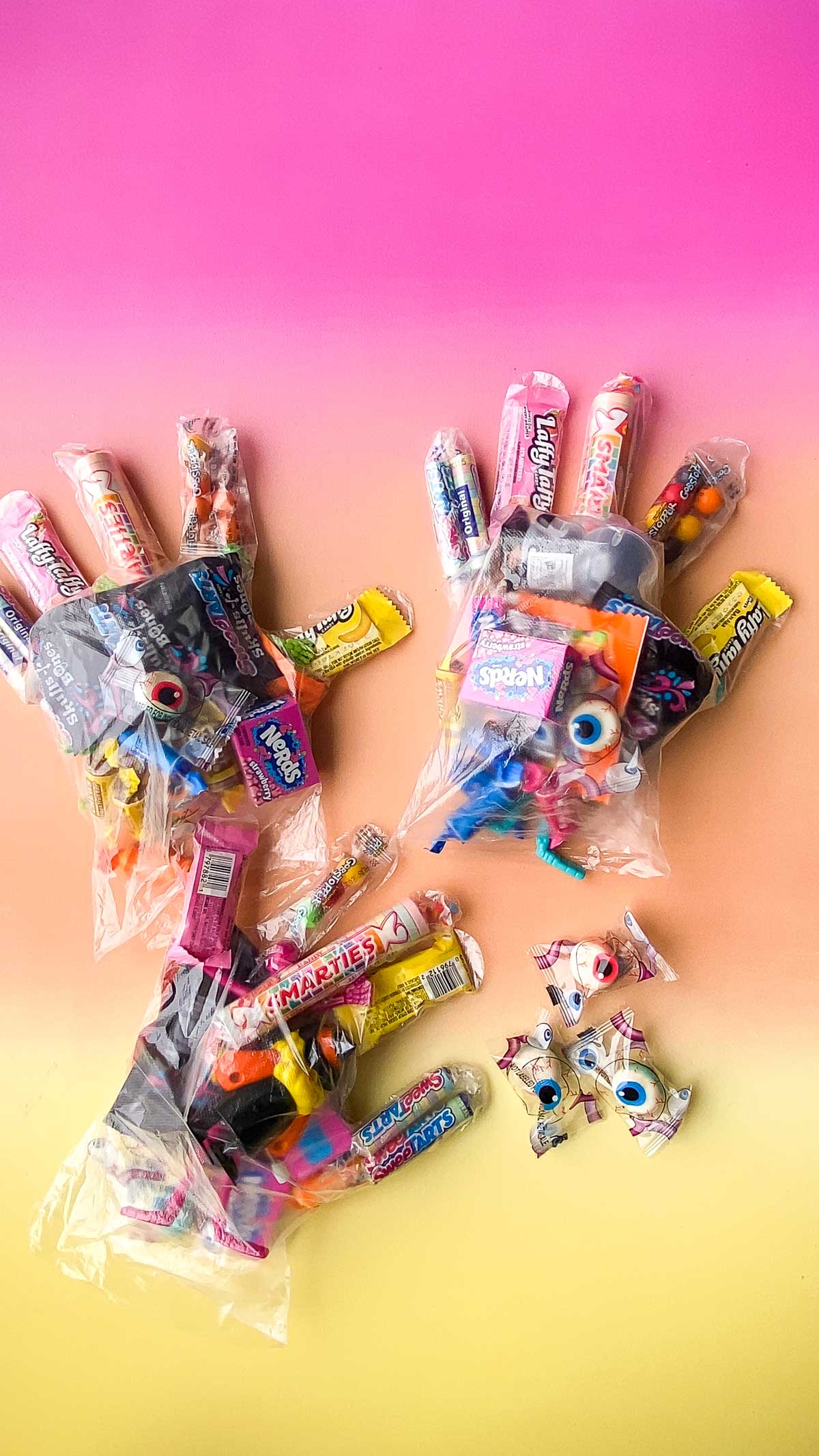 plastic gloves with Halloween treats inside