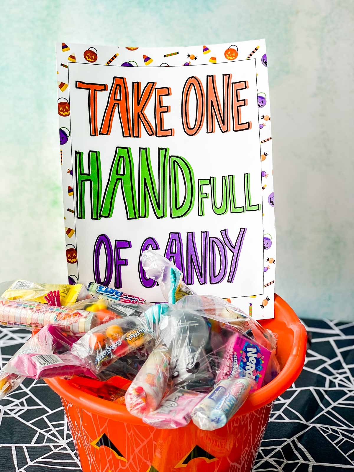 bucket with a Halloween candy sign in it