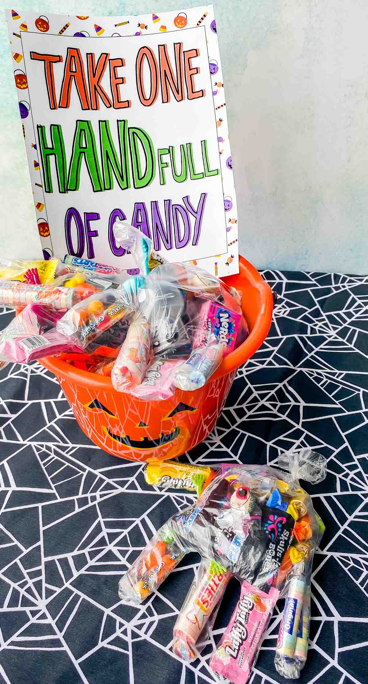candy hands with a Halloween candy sign