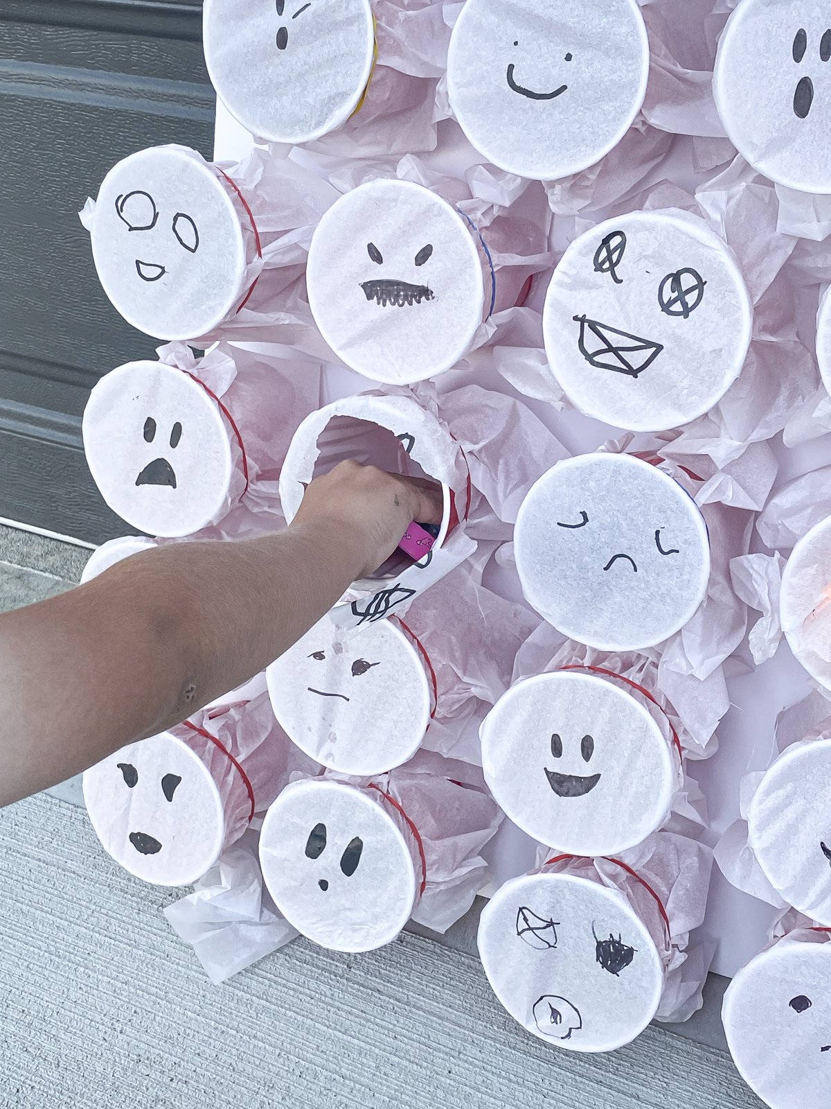 Kid grabbing prizes out of a ghost punch game