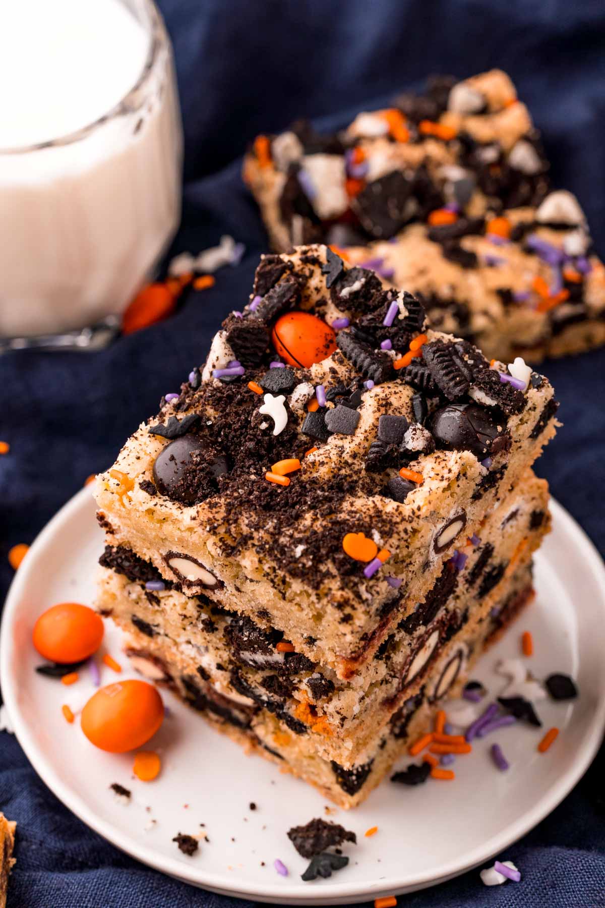 stack of Halloween M&M cookie bars on a white plate