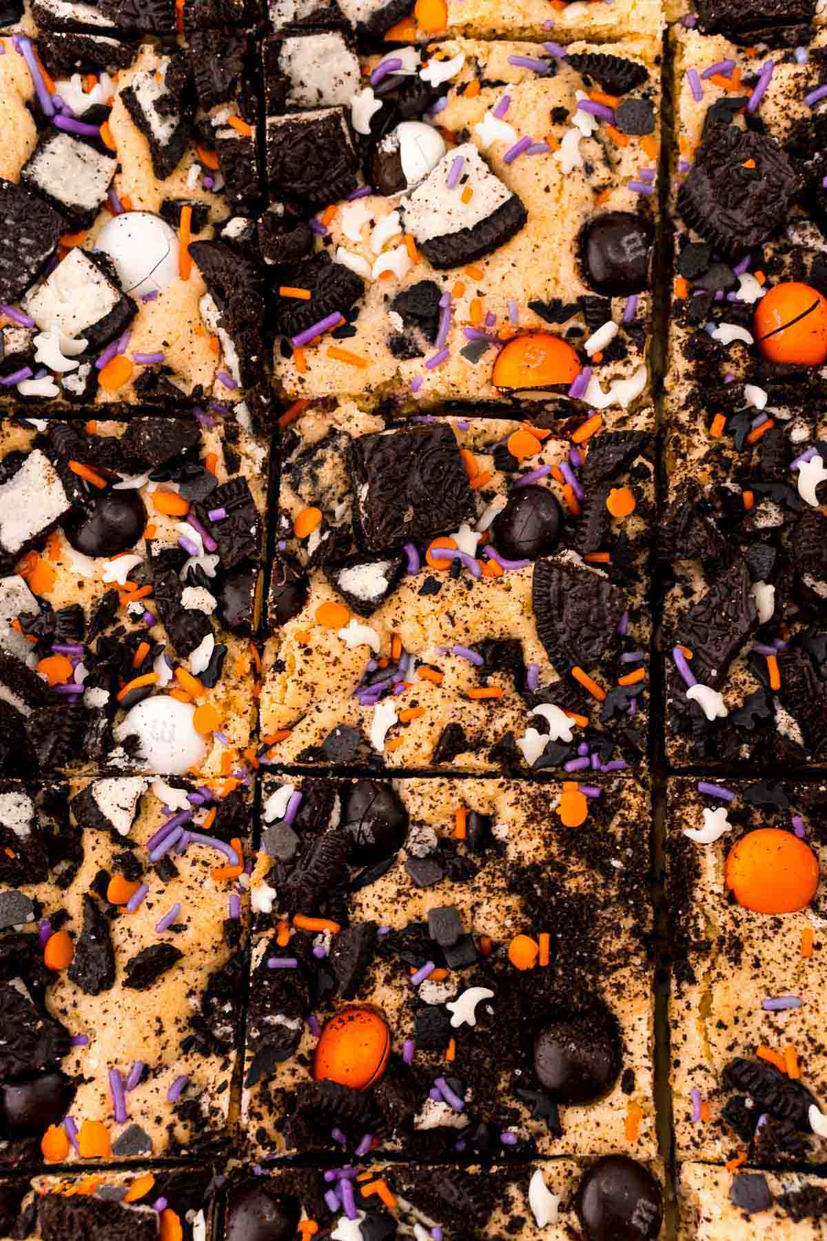 cut M&M cookie bars with Halloween sprinkles
